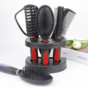 Mirror and comb five-piece set, including cushion massage brush, roller comb, and styling comb with base.