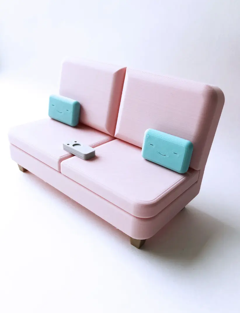 The Colab Couch Phone Holder with Remote and Pillows The Colab Couch Phone Holder with Remote and Pillows