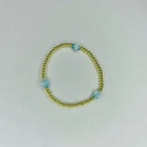 The fresh bracelet - 6.5” stretchy bracelet Made with: 3mm round gold plated hematite beads with 8mm white color mother of pearl crossbeads