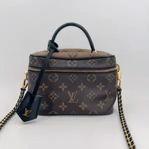 Pre-owned Louis Vuitton canvas Crossbody Bags Vanity PM Brown Coated Reverse Monogram