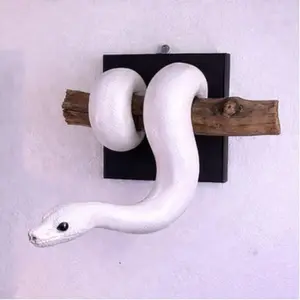 An interesting wall sculpture featuring golden ball pythons