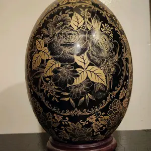 Satsuma-style Porcelain Egg Featuring Black and Gold Floral Designs with Elegant Detailing and Rich Aesthetic