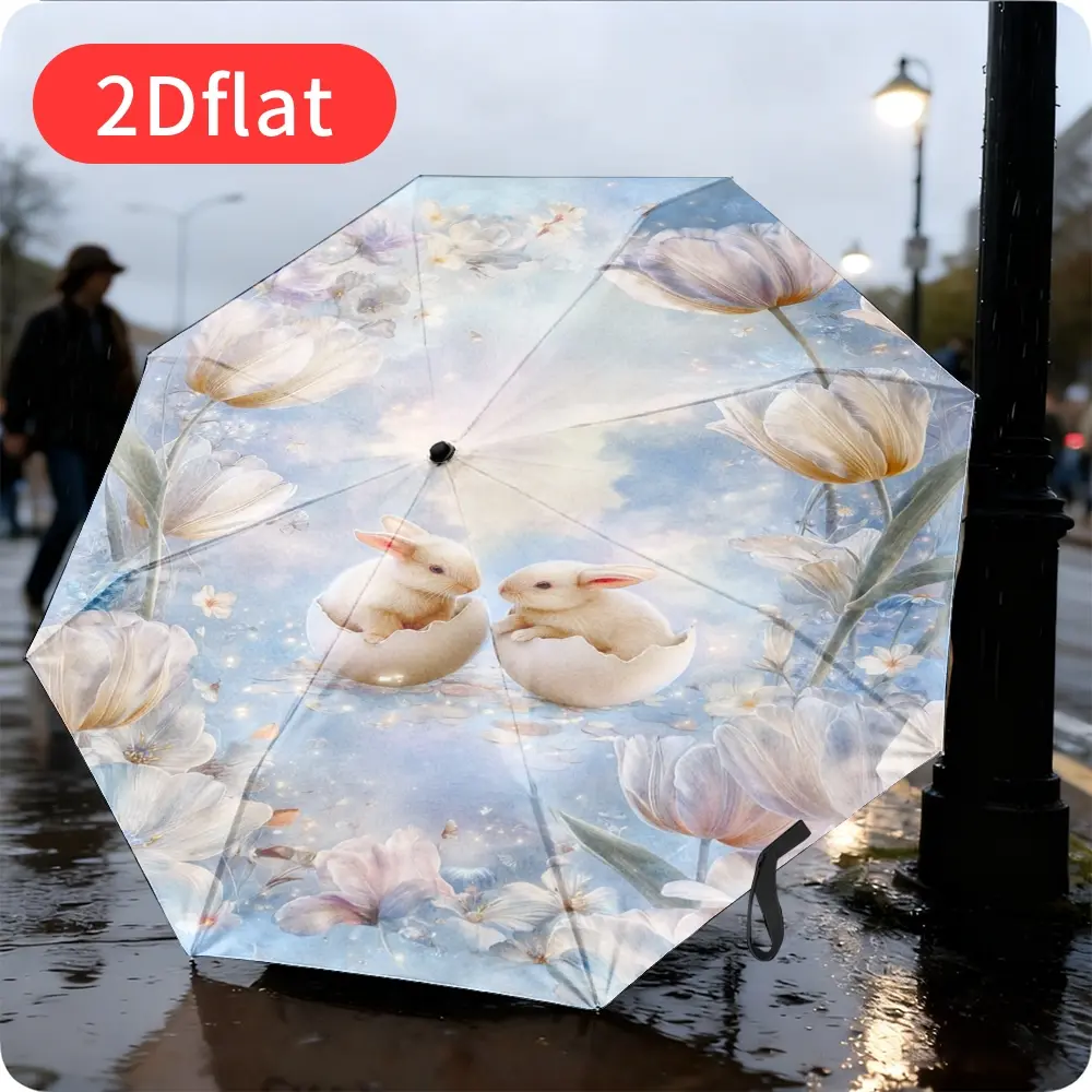 An Easter Bunny Folding Umbrella – featuring an adorable bunny nestled inside an eggshell against a soft floral background. Lightweight and portable, with a durable canopy made of sturdy plastic and metal, perfect for