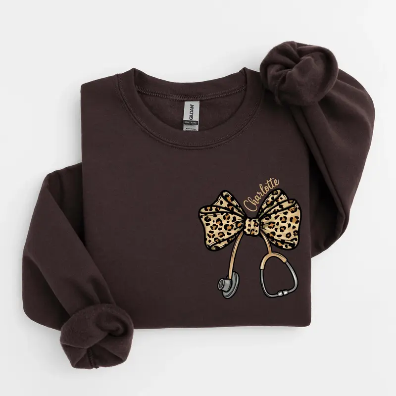 [Custom Name] Leopard Stethoscope Bow Sweatshirt or T-Shirt, Coquette Nurse Hoodie, Nurse Appreciation Gift, Nursing Student Sweatshirt, Healthcare Sweater.