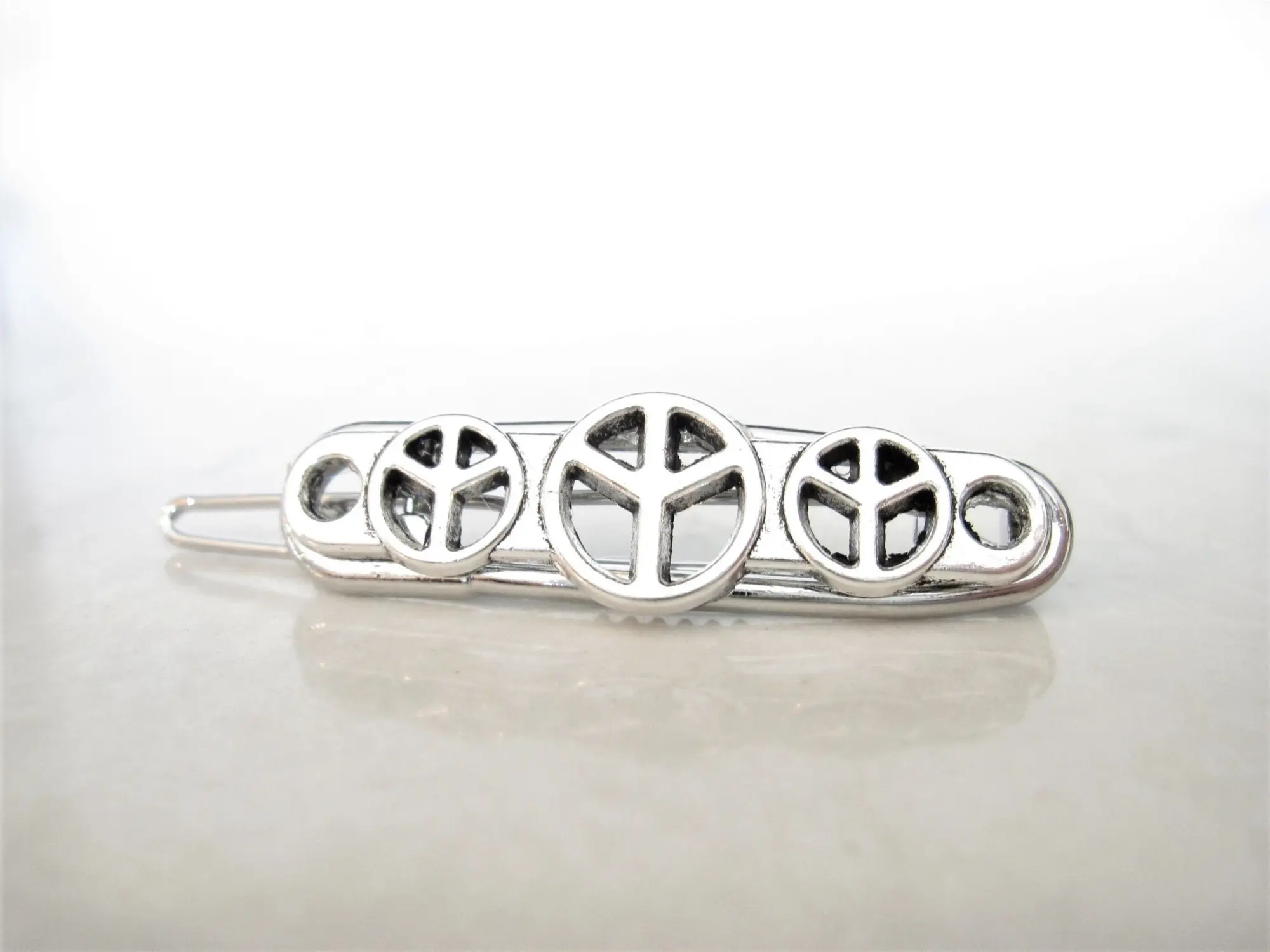 Small silver metal peace sign hair pin barrette for fine thin hair