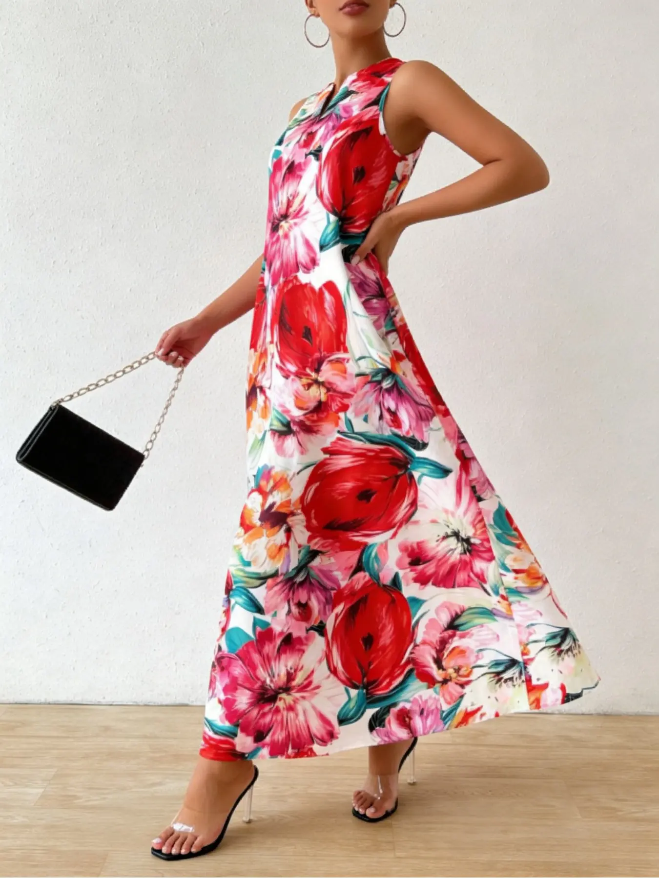 A sleeveless long loose, Casual bohemian, Boho floral printed dress for women with a small V-neck, featuring red and pink floral prints on a white background, perfect for summer garden afternoon tea or a city rooftop restaurant date