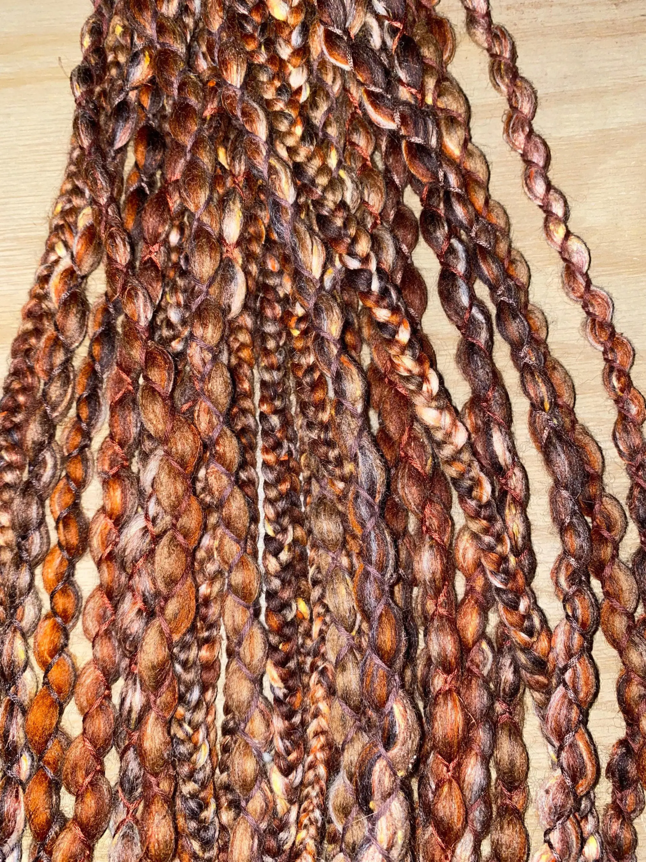 Fancy brown double ended and single ended wool dreadlock extensions