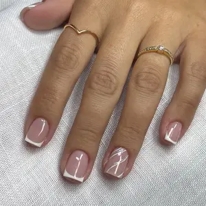 An elegant short square French manicure featuring soft nude pink nails with crisp white tips, paired with a delicate silver and white swirl accent design on the ring finger, creating a timeless and sophisticated look perfect for any occasion.