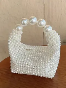 Small stylish exquisite pearl handbag, hand-strung with pearls, large pearl handles, fashionable and versatile dinner bag, Fashionable evening bag, niche design suitable for dinner, daily travel, shopping and dating, Classic handbag