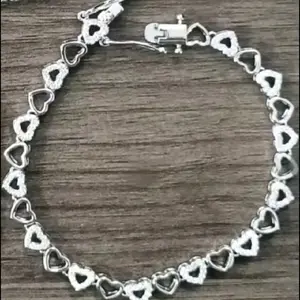Hearts Bracelet - Heart-Shaped Design, Silver Finish, Adjustable Chain with Clasp Closure