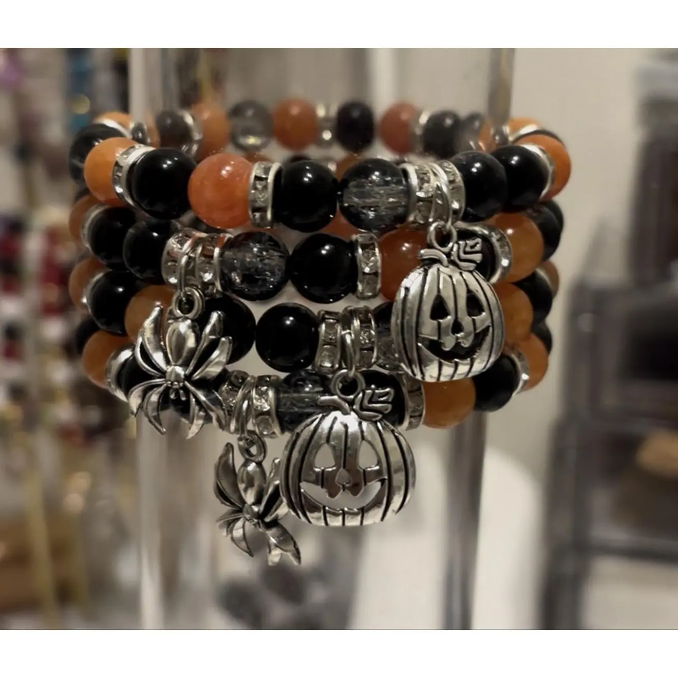 Halloween-themed Beaded Bracelet with Pumpkin and Spider Charms in Black and Orange