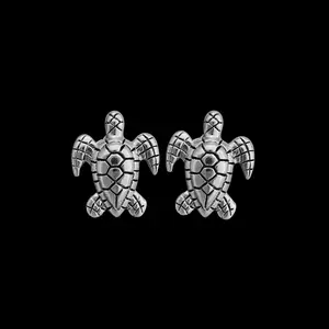 Small Sterling Turtle stud earrings with intricate details on the shell and body