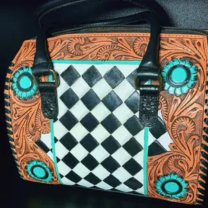 Medium tooled leather speedy bag with had painted black and white checkered and Conchos