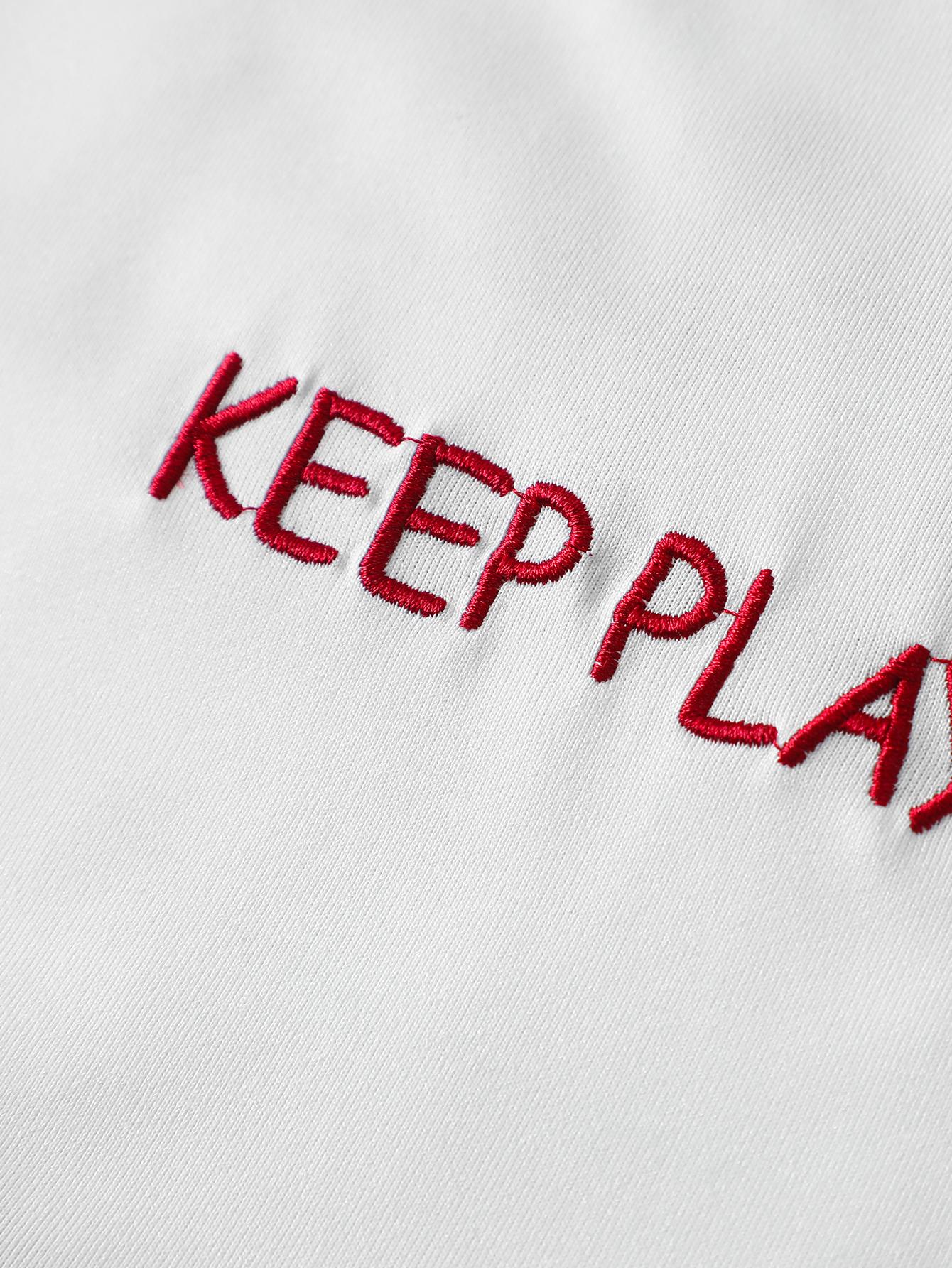 Unisex two-piece set, cropped Y2K street style. Short-sleeve loose oversized top featuring a curved back and towel embroidery with lettering. Perfect for summer fashion styling and trendy parties; an ideal gift for a boyfriend or husband.