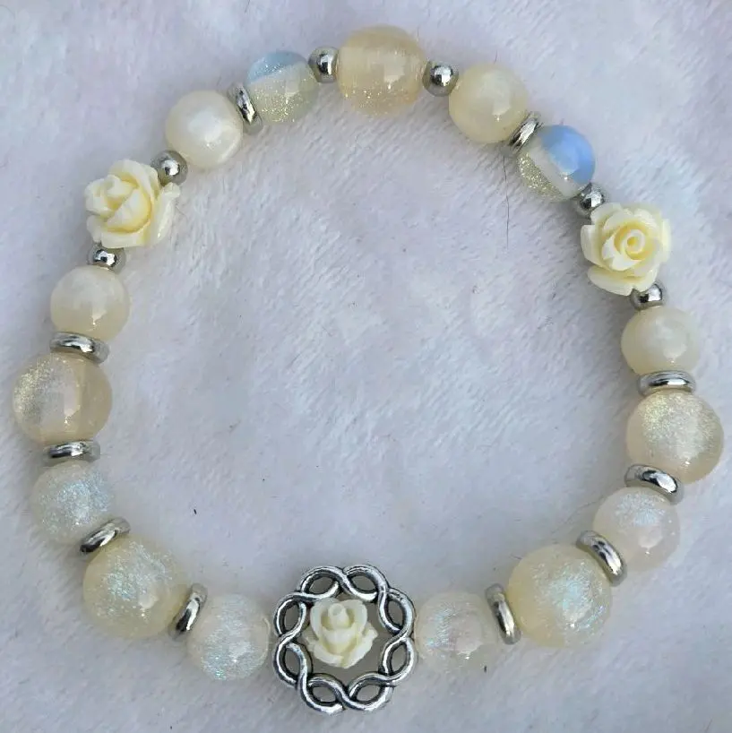 Perfection in Ivory Bracelet with Rose Design and Silver Tone Beads