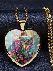A transparent glass heart-shaped necklace adorned with a beautiful owl design.