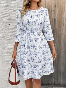 A women's casual fashion white base with blue floral print round neck seven-eighths sleeve waist-cinching A-line midi dress, suitable for spring and summer, ideal for commuting, daily leisure, parties, and vacations