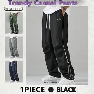 Loose-fitting sweatpants for men, grey side stripes with gold accent stripes, comfortable design, sports casual style bottoms, sweatpants, fitness wear, today's fashion outfit