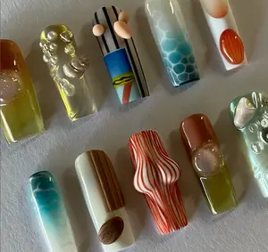 Avant-Garde 3D Nails – Sculptural surrealist designs with bubbles, wood grains, marble swirls, stripes, and fluid textures