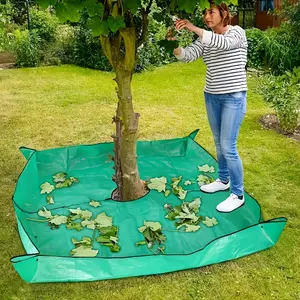 This is an asphalt landscape cover for pruning around a moonhouse, measuring 100.0cm x 100.0cm with 20.0cm holes, including traps for pruning shrubs, equipped with four corner clips for easy installation and leaf collection, Reusable Plant Cover