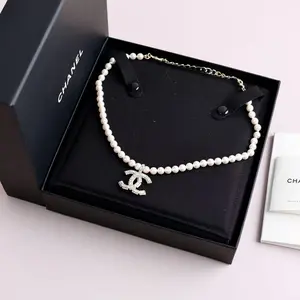 Pre-owned Chanel Pearl with Silver Crystal Logo Necklace 0514GIA