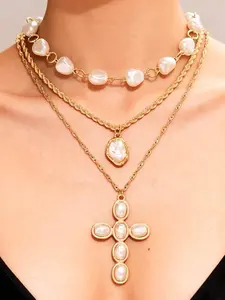 A pair of fashionable, design-driven, elegant, and sophisticated pearl cross necklaces for women, suitable for daily commuting, festivals, and parties, as well as women's earrings