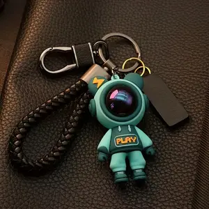 Cute Astronaut Keychains: Lightning & Cartoon Spaceman Designs For Couples, Silicone Style With Red Helmets, And Crystal-Embellished Alloy Versions - Ideal Fashion Accessories For Car Keys, Bags, Parties & Gifting