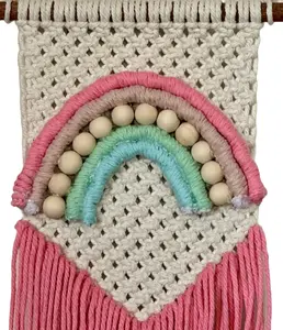 Pink macrame rainbow wall hanging