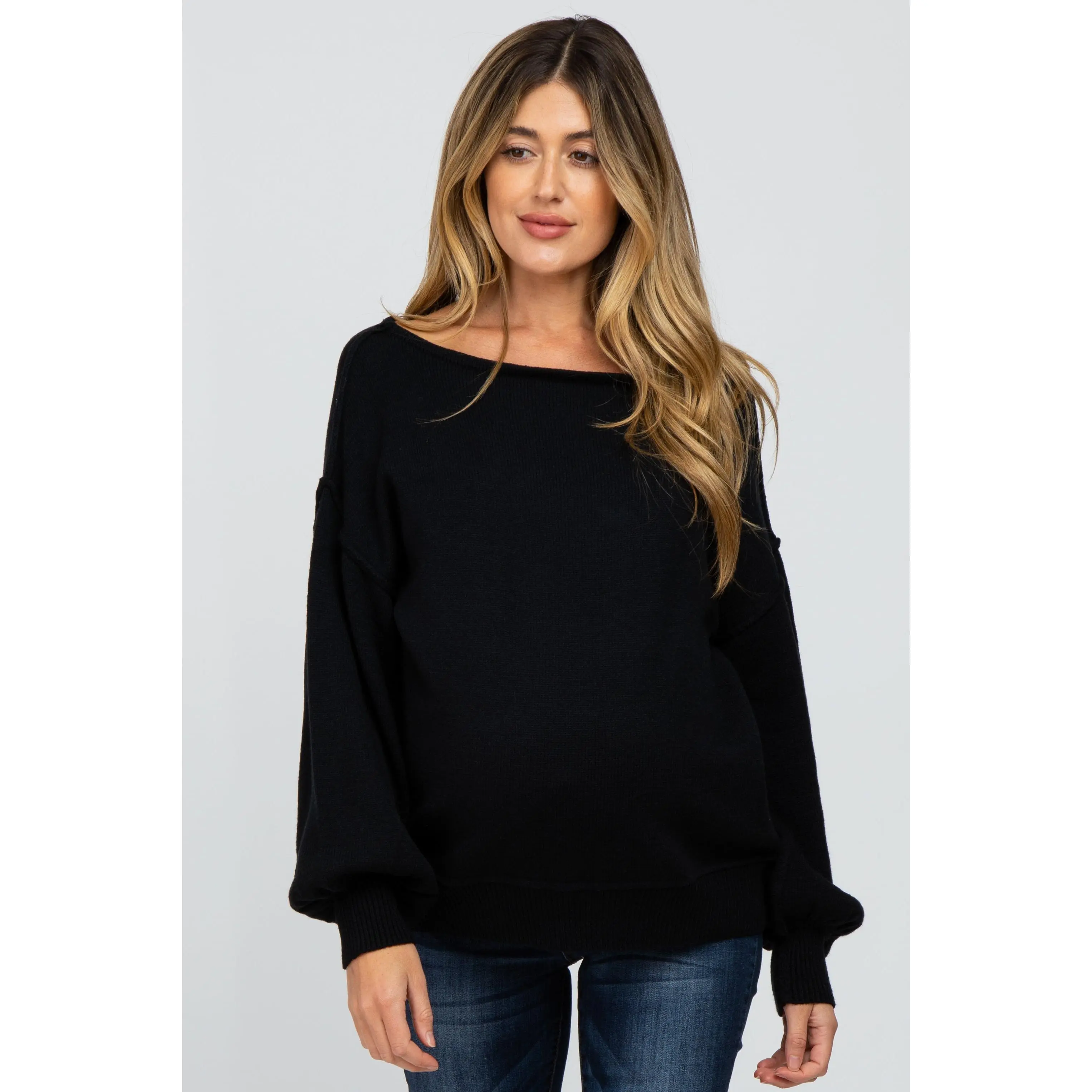 Ultra Soft Black Knit Maternity Sweater with a Boat Neck, Long Bubble Sleeves, and Exposed Seam Detailing
