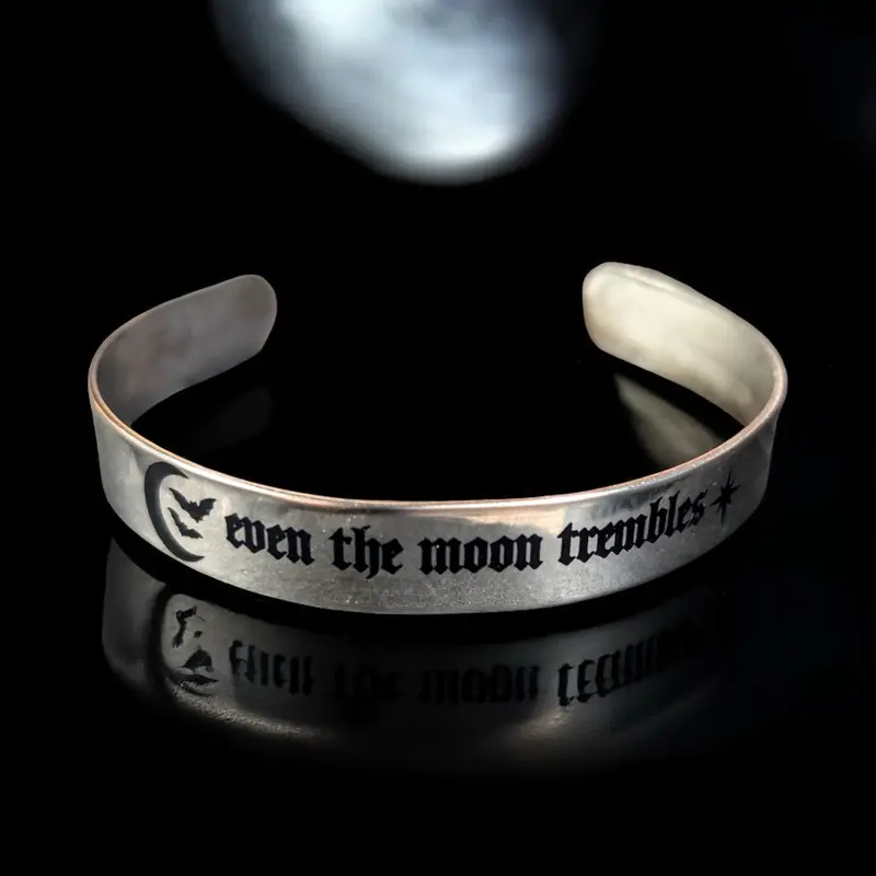 Notoriously Morbid Even The Moon Trembles Stainless Steel Bangle Bracelet with Gothic Text Design & Symbolic Logo Adjustable Fit