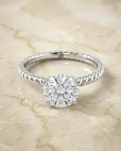The Charlie Twisted Engagement Ring Setting for Round Diamonds in Platinum