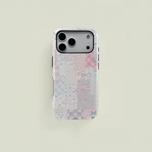 A stylish double-layered protective case with a checkered bow and floral design. Durable and sturdy, this 2-in-1 case is compatible with iPhone 17/16/15/14/13/12/11 Pro Max/Plus/Pro and Samsung Galaxy S25/S24/S23 Ultra series.