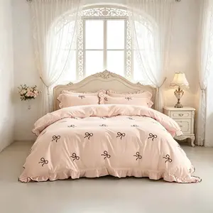 3-Piece Pink Bow Bedding Set with ruffled duvet cover and pillowcases, without fillers, a must-have for exquisite home decor.
