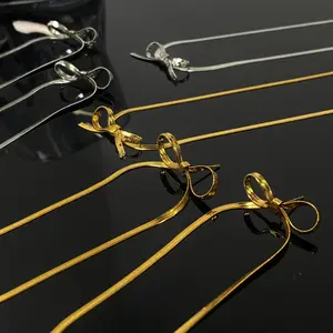 Women's Sleek Plated Stainless Steel Bow Clavicle Necklace - Durable Golden Ribbon Chain, Elegant Artificial Gemstone Jewelry Accessory for Daily Wear
