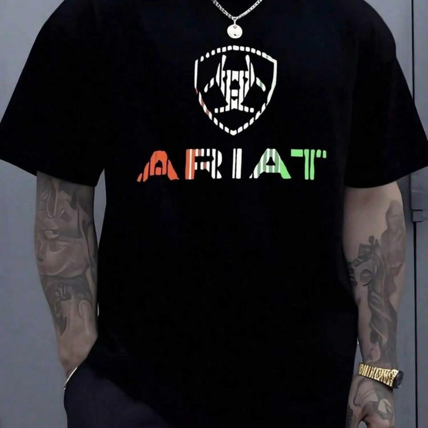 Women's 100% Cotton T-Shirt - Abstract Shield Emblem With Geometric Lines, Symbolizing Modern Strength And Identity, Featuring ARIAT Branding