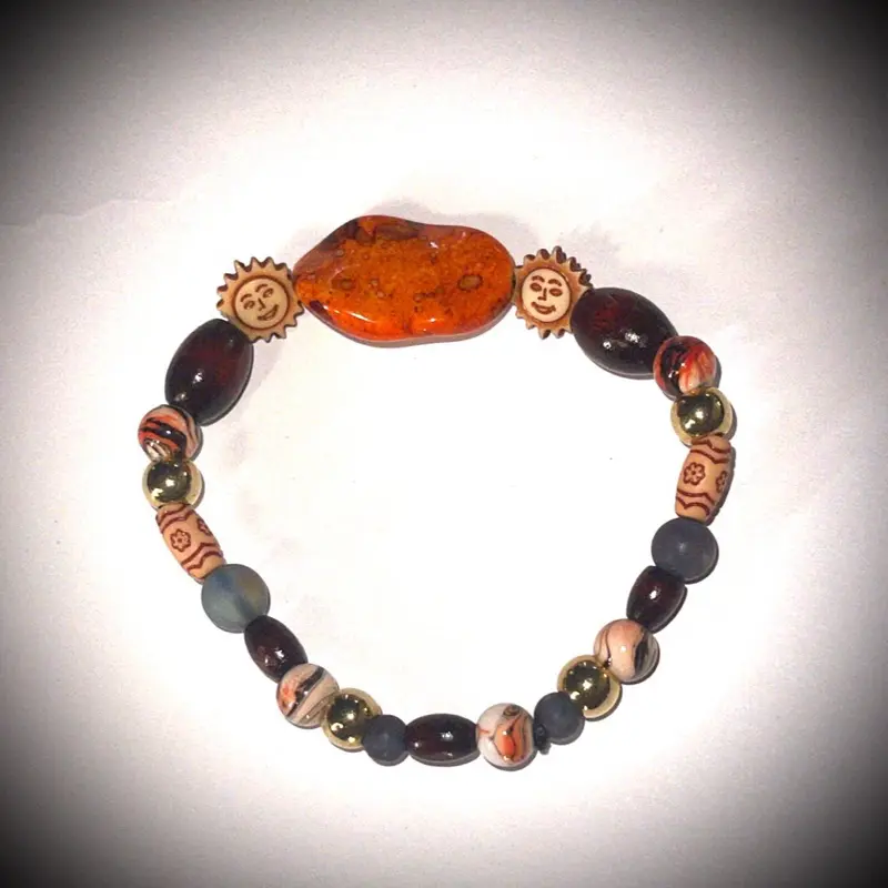 “Sunny Day Charm Bracelet“ with glass and wood beads. Color orange and red with smiley face sunshine beads and orange clay charm