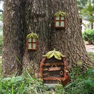 Miniature fairy doors and fairy gardens for trees, garden sculptures and lawn decorations that can glow in the dark, and miniature outdoor art decorations with lanterns.