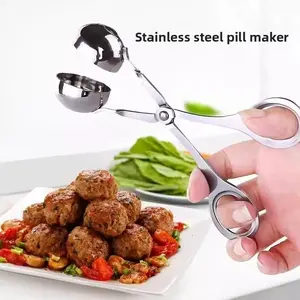 Meatballs with stainless steel meatball maker - kitchen appliance for making fried meatballs. Fish balls and rice ball mold - kitchen tool.