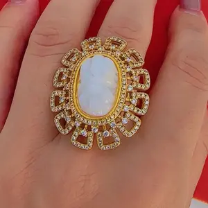 Gold plated lord ganesh adjustable Ring with multiple stones on it