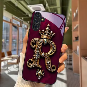 This wine-red royal-style crown and "R" pattern phone case features a skin-friendly, glass-like finish and a clear white glass surface. It's compatible with iPhone 17, 16, 15, 14, 13, 12, 11, and Samsung models. A perfect gift for friends or family.