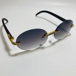 The Carat Round Rimless Sunglasses with Faux Diamond Accents and Metal Frame x Available in Five Colors