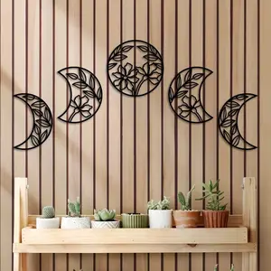 A set of 5 captivating metal moon phase wall hangings. Infused with floral leaf elements in Nordic style, they're ideal wall ornaments for a unique decor touch. Decorative hanging ornaments