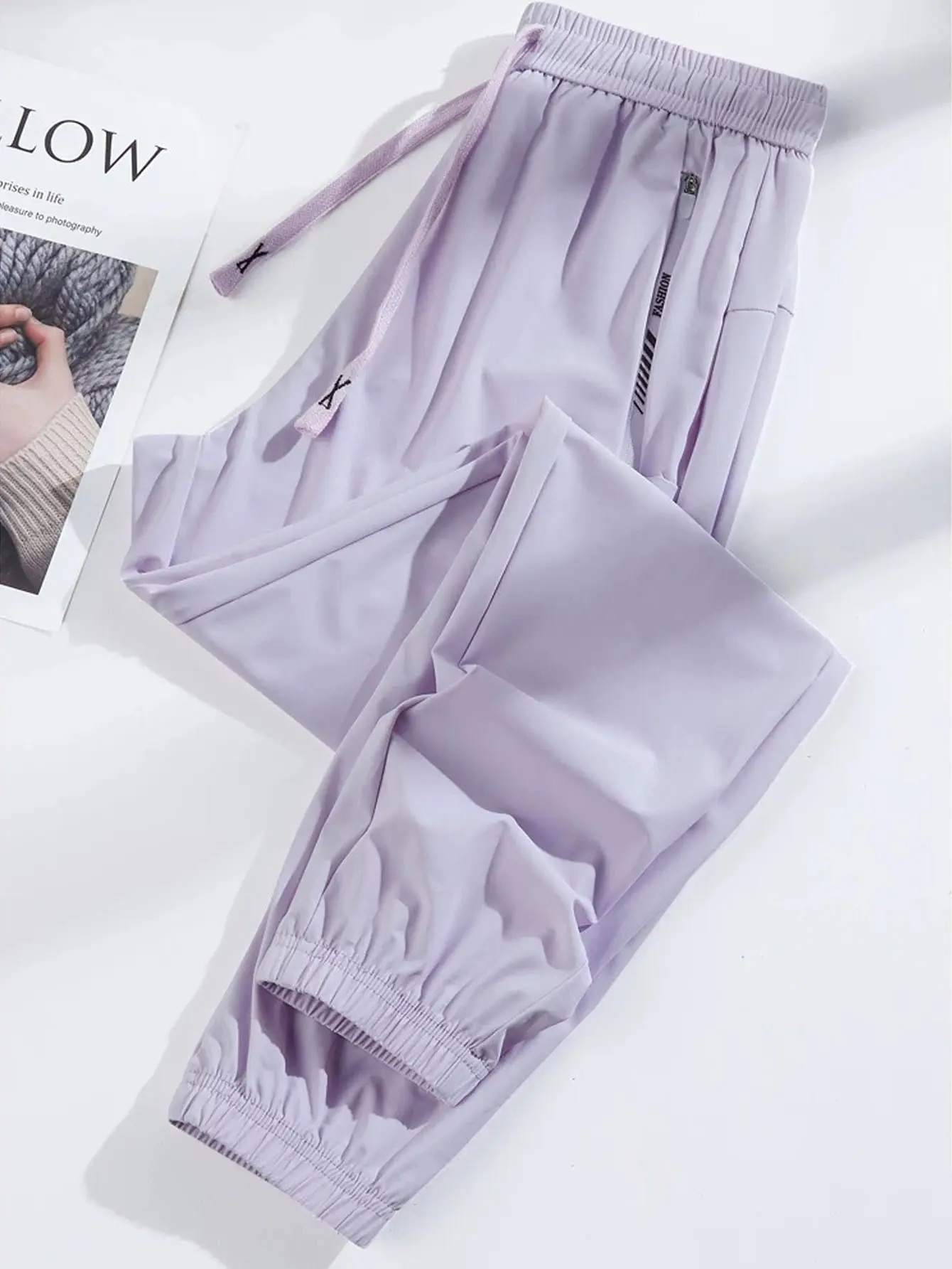 women’s athletic and casual nine-tenth pants made from highly elastic fabric, featuring a drawstring waist and zippered pockets. Colors are true and diverse, stylish and versatile, suitable for everyday wear, gym yoga workouts, outdoor