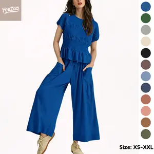 YeeZaa Women's Boho Matching Sets 2 Piece Pants Set Summer Vacation Smocked Top Wide-Leg Pants Sets 2026 Summer Two Piece Lounge Matching Sets Outfits Short Sleeve Ruffle Peplum Top High Waisted Beach Set with Dropped Pouch Pockets Clothes Oversized Gamis