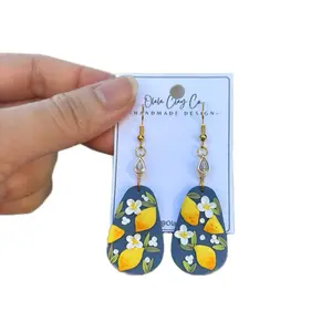 Olalaclayco Handmade Polymer Clay Earrings with Lemon and Floral Design Gold Teardrop Hooks by Olalaclayco
