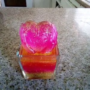 Resin Decor - Heart-Shaped Glitter Resin in Clear Container, Perfect for Home Decor and Gifts