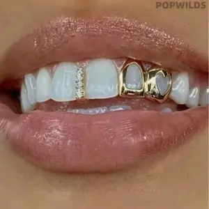 Trendy hollow heart double tooth grills in sleek gold finish, perfect for European and American street style and hip-hop looks. Stylish and smooth to wear, this chic dental accessory adds cool vibes to daily outfits and party appearances.