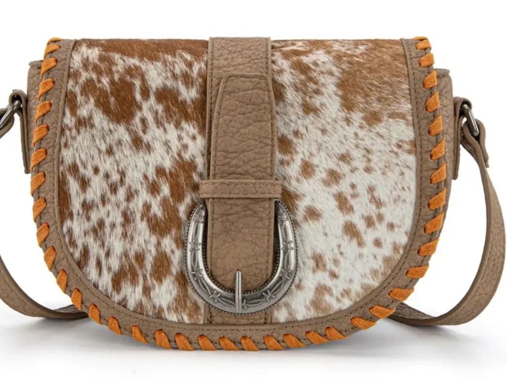 TRINITY RANCH COWHIDE SADDLE CROSSBODY BAG