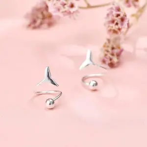 A pair of fishtail spiral earrings with a screw clasp design, featuring a preppy style, nautical elements, and a fashionable and simple design, suitable for various everyday occasions.