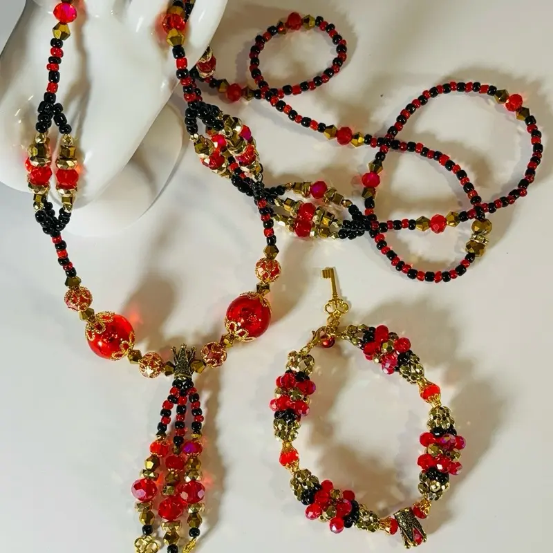 Eleguá bead and necklace with gold details